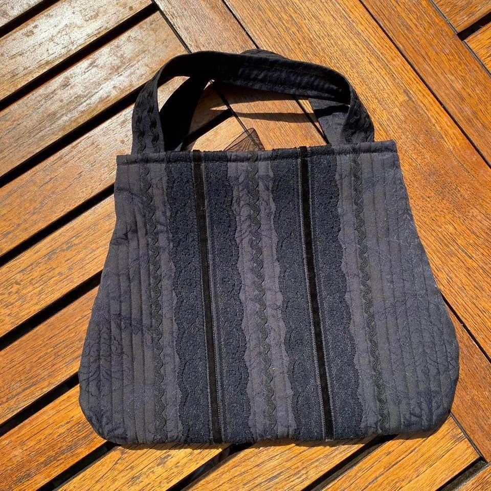 Black lace fabric handbag